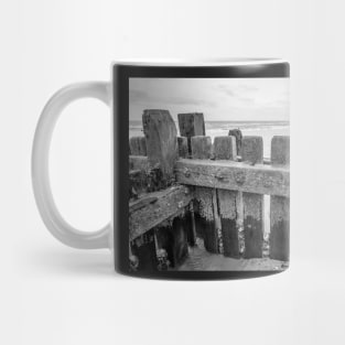 Close up of wooden sea defences protecting against coastal erosion Mug